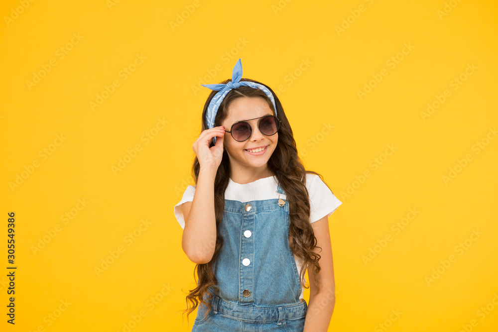 protect your eyes. small kid vintage sunglasses. Vacation mode on. Little fashionista. Kids clothes shop. retro girl. Summer fashion. cheerful little girl yellow background. retro child long hair