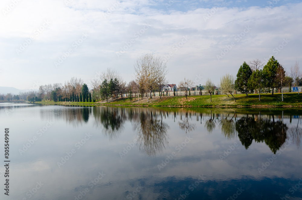 Autumn landscape with reflection of trees in water Autumn landscape with reflection of trees in water