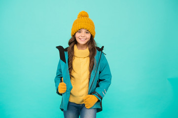 Winter vacation. Protective clothes. Winter collection. Child wear hat gloves jacket. Active leisure. Sporty style. Carefree childhood. Cute girl enjoy winter season. Little kid wear knitted hat