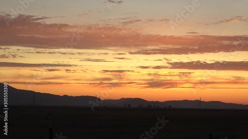 Wallpaper Mural Clouds move slowly over Northern California fields during a gorgeous orange sunset Torontodigital.ca