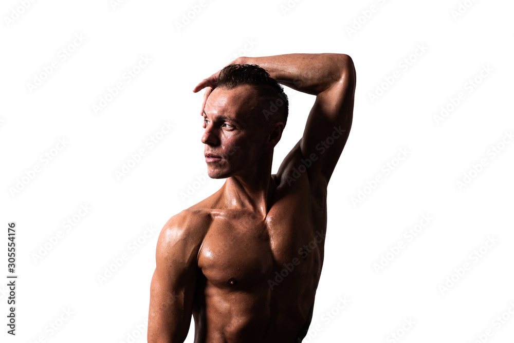 Athletic man looking left and showing muscles. Isolated on a white background. Athletic man looking left and showing muscles. Isolated on a white background.