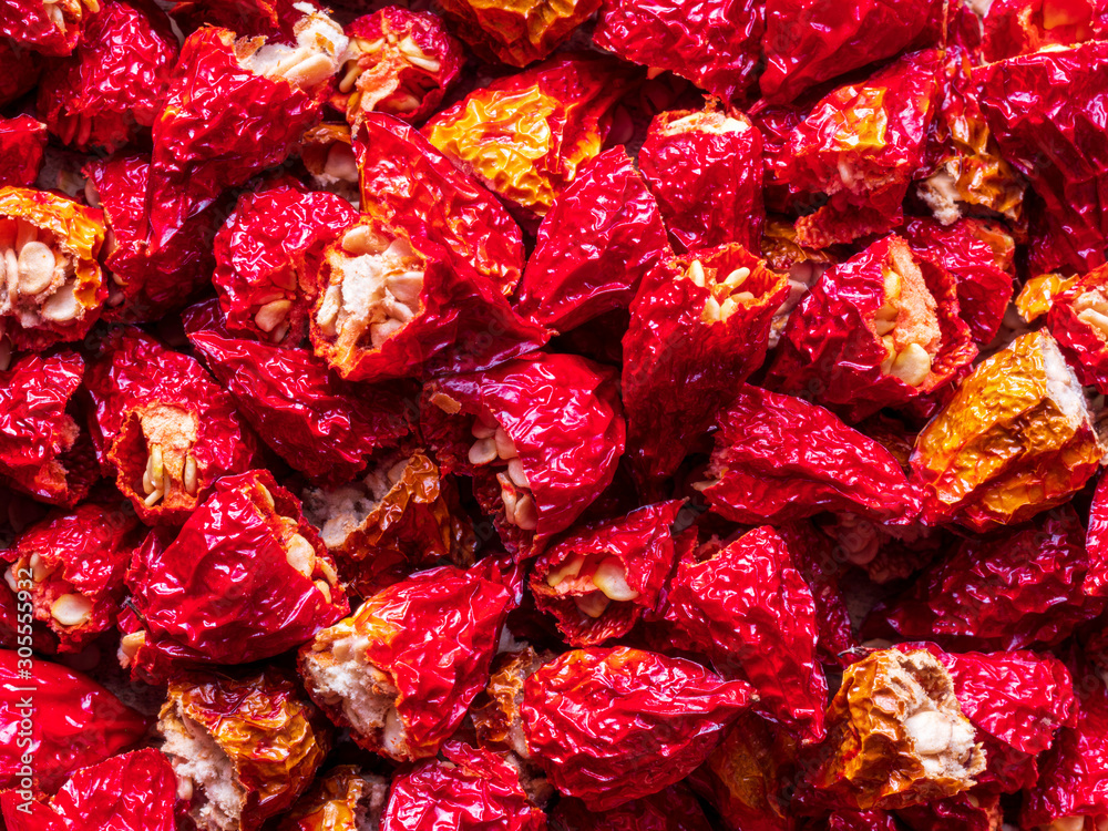 Hot and dry NuMex Red Chili Pepper at flat surface Hot and dry NuMex Red Chili Pepper at flat surface
