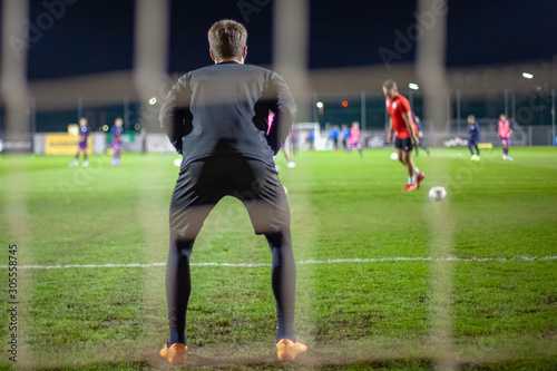 Fotografija Goalkeeper catch the ball when defensive on goal during a football match