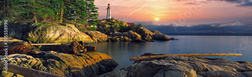 Whytecliff Park in Greater Vancouver British Columbia Canada in the Pacific North West featuring still calm waters of the ocean and a path of rocks leading to an island.  Featuring cityscapes.