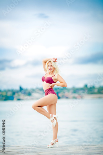 Female model in bikini on nature background