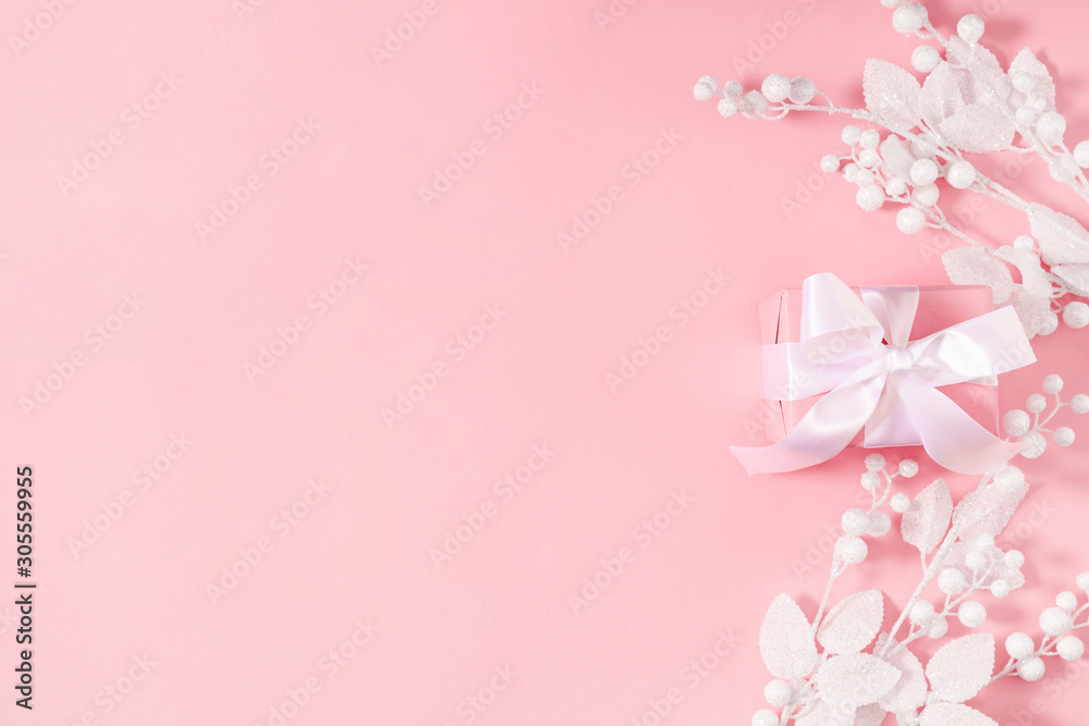 Christmas minimal composition. Frame made of Xmas white decorations on pastel pink background. New Year, winter concept. Flat lay, top view, copy space