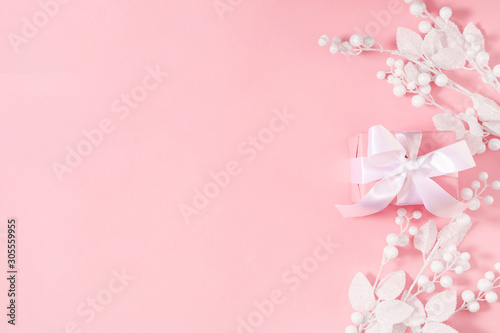 Christmas minimal composition. Frame made of Xmas white decorations on pastel pink background. New Year, winter concept. Flat lay, top view, copy space © prime1001