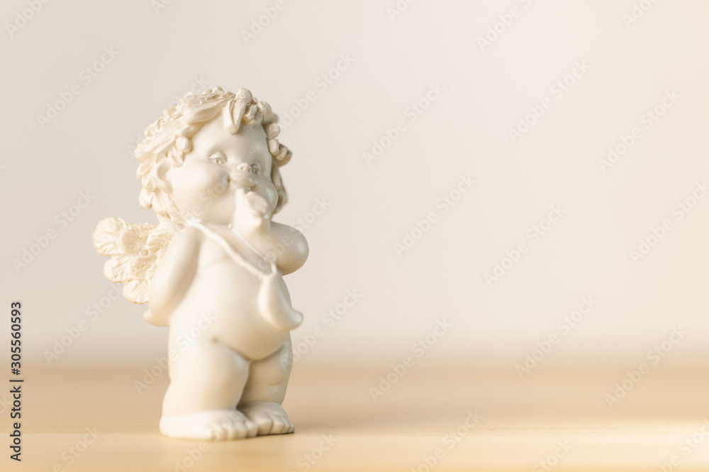 plaster figurine of a little angel with a place for inscription plaster figurine of a little angel with a place for inscription