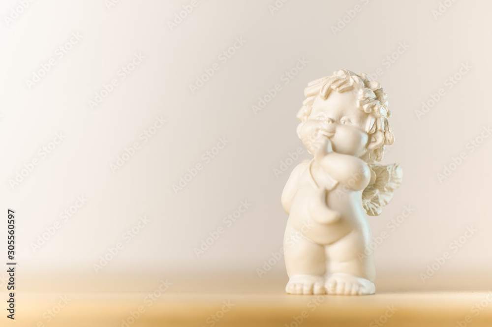 plaster figurine of a little angel with a place for inscription plaster figurine of a little angel with a place for inscription