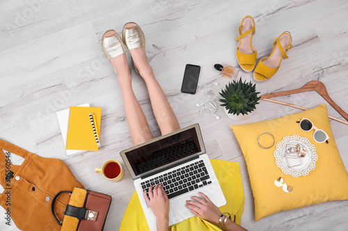Photography Fashion blogger with laptop sitting on floor, top view