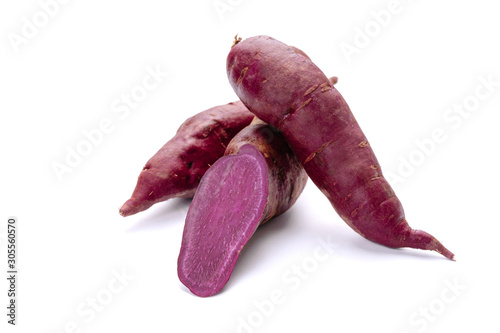 Purple Sweet Potato Pile of Tuber Pieces Isolated on White Background. Organic Batata with Violet Colored Soft Flesh Clipping Path. Natural Vegetable Yam Rich Flavour for Vegan Dietary photo