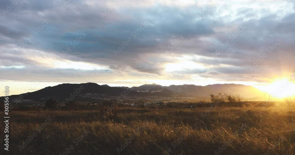 A golden sunset in the mountains with clouds near Málaga, Spain A golden sunset in the mountains with clouds near Málaga, Spain