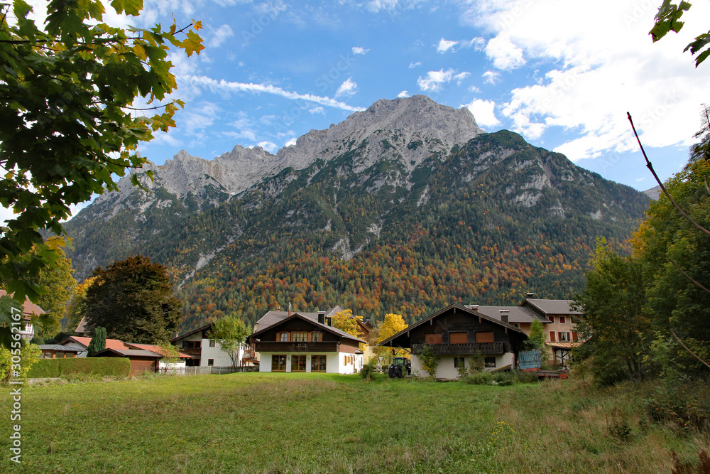 Building in Mittenwald, Germany, with karwendel mountains in the background.