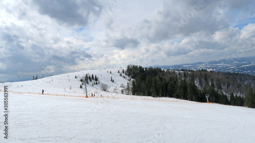 wonderful snowy mountain landscape in early spring