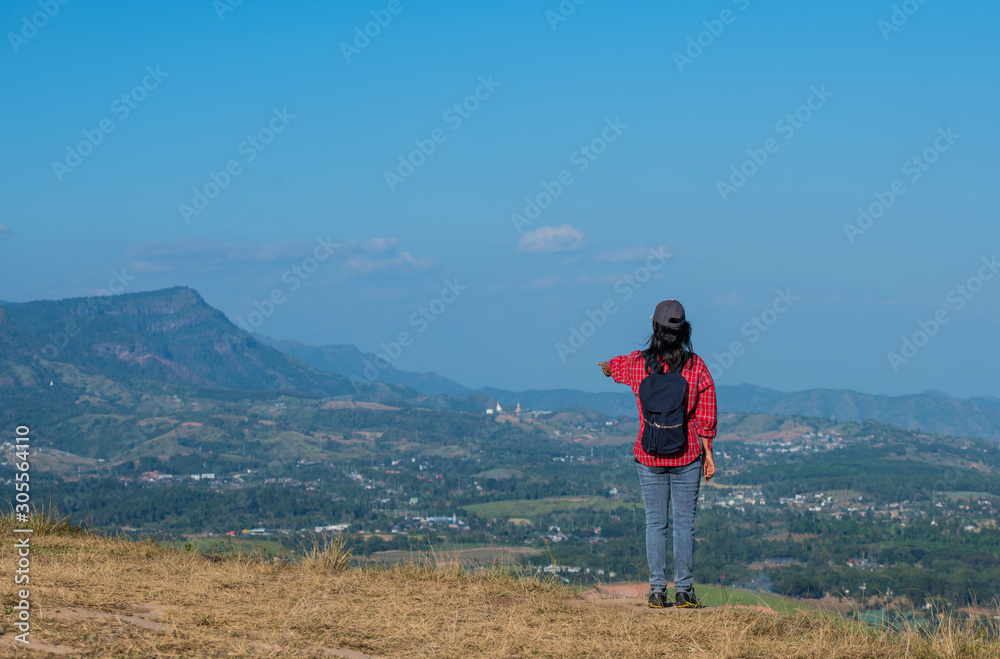 Retired woman Happy to travel on high hills. Retired woman Happy to travel on high hills.