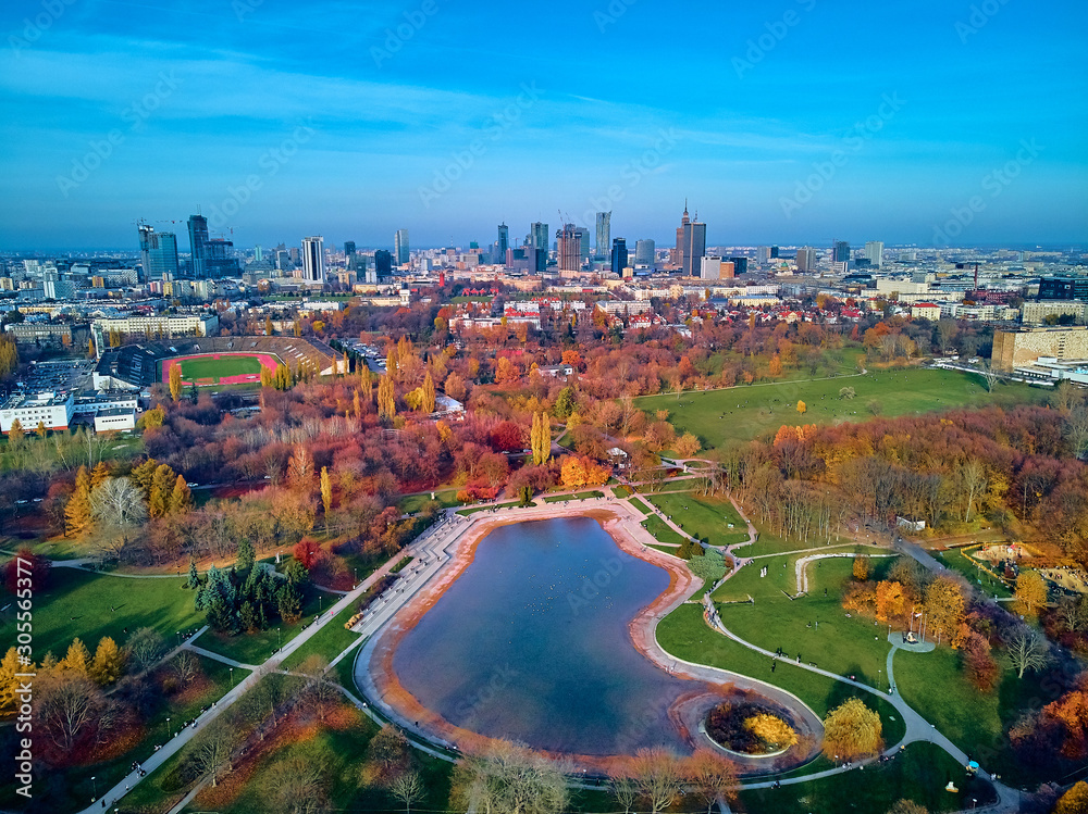 Fototapeta premium A beautiful panoramic view of the sunset in a fabulous November autumn evening at sunset from drone at Pola Mokotowskie in Warsaw, Poland - Mokotow Field is a large park called 