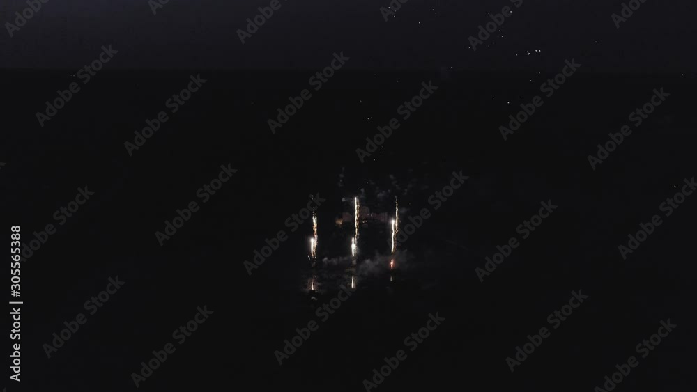 Fireworks near Old Manor by the lake in Europe 4k Drone shot Fireworks near Old Manor by the lake in Europe 4k Drone shot