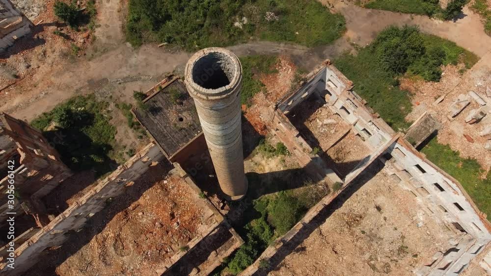 Industry and business production. Ruins and factory pipe of abandoned destroyed facility. Regression decline of plant manufactory. Aircraft drone aerial survey Industry and business production. Ruins and factory pipe of abandoned destroyed facility. Regression decline of plant manufactory. Aircraft drone aerial survey