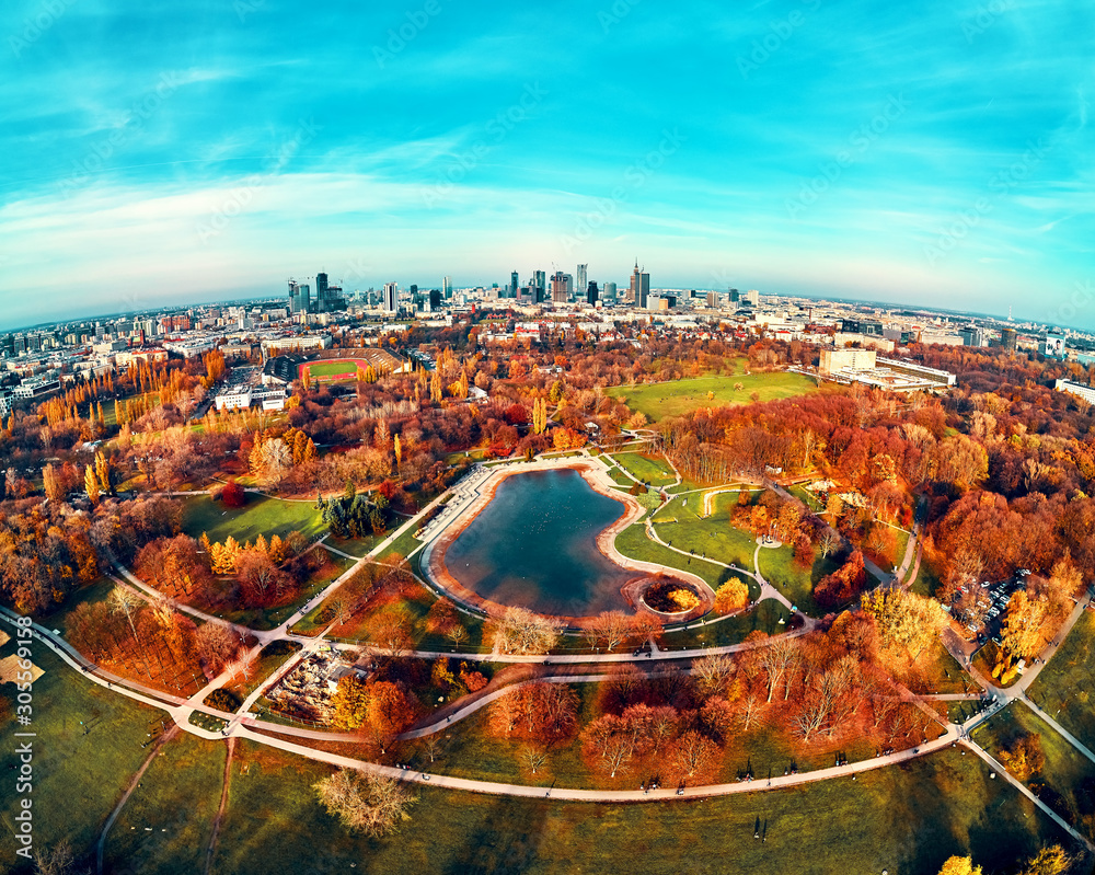 Obraz premium A beautiful panoramic view of the sunset in a fabulous November autumn evening at sunset from drone at Pola Mokotowskie in Warsaw, Poland - Mokotow Field is a large park called 
