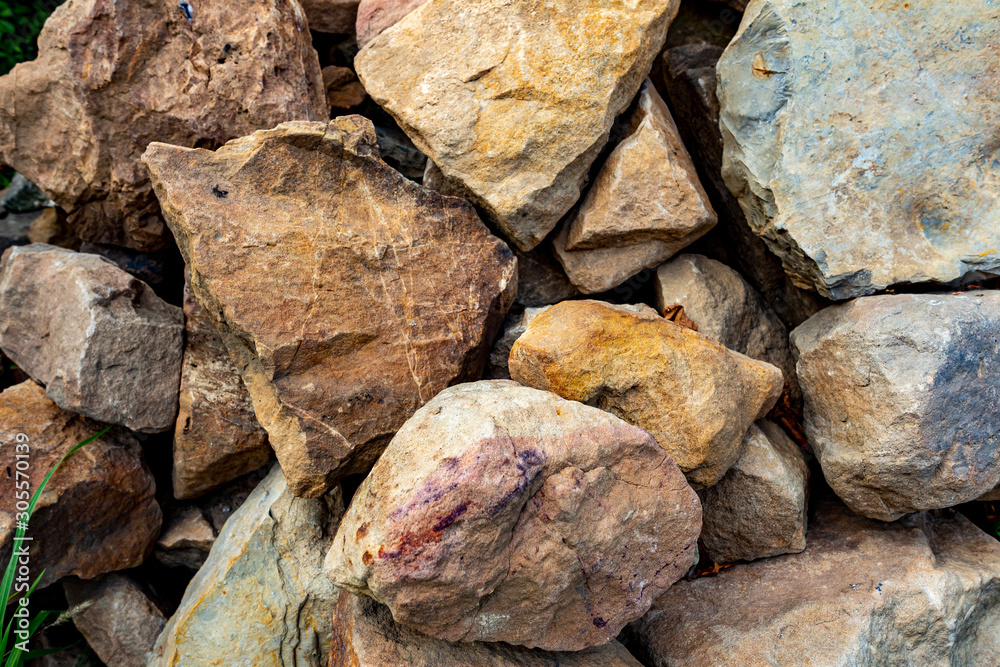 Close-up on piles of stones. Background with big stones Close-up on piles of stones. Background with big stones