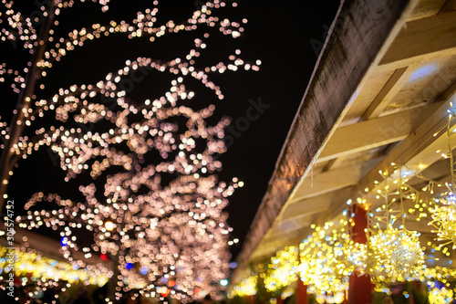 Christmas decorations on the street, colorful holiday bokeh lights, city night illumination