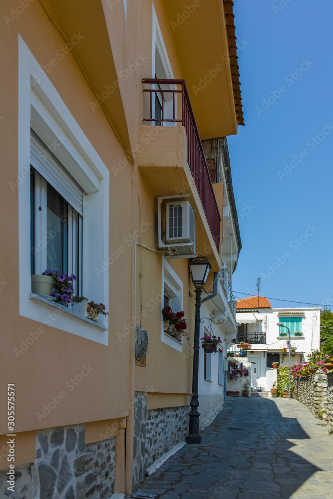 Fototapeta premium Typical street and houses at old town of city of Kavala, Greece