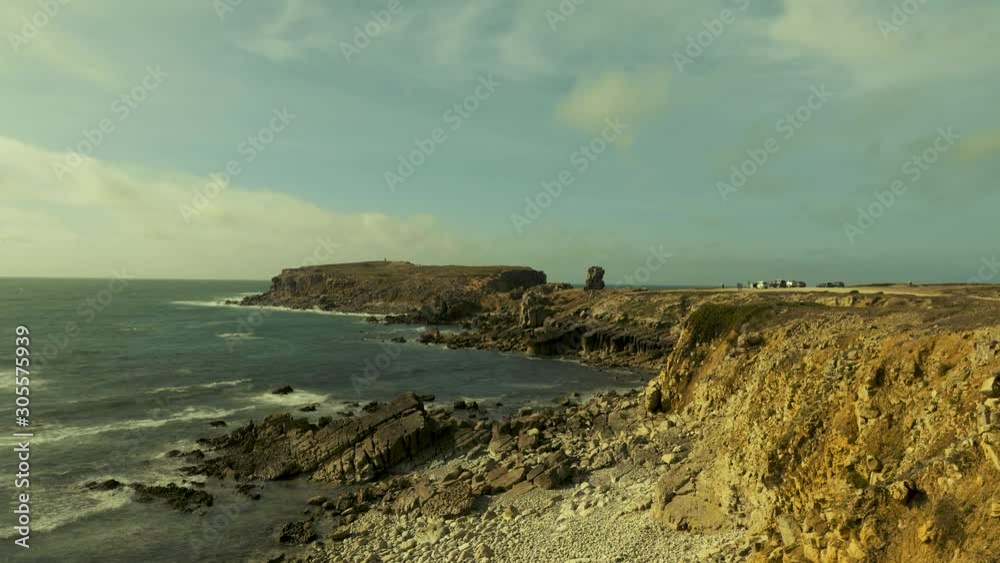 Clouds move very fast over stony coast in twilight where people can be seen - Time Lapse Clouds move very fast over stony coast in twilight where people can be seen - Time Lapse