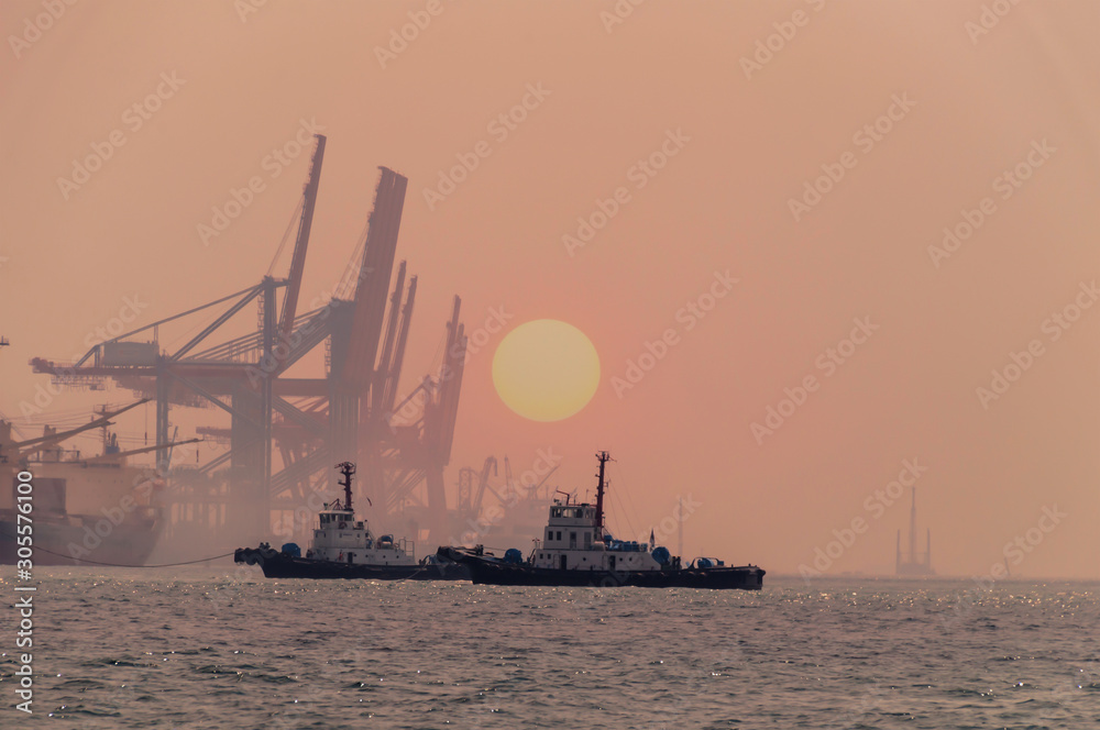 Silhouette Logistics and transportation of International Container Cargo ship in the ocean at Sunshine sky, Freight Transportation, Shipping