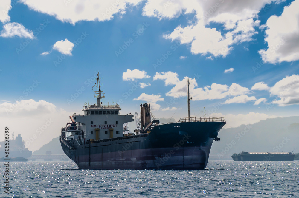 Silhouette Logistics and transportation of International Container Cargo ship in the ocean at Sunshine sky, Freight Transportation, Shipping Silhouette Logistics and transportation of International Container Cargo ship in the ocean at Sunshine sky, Freight Transportation, Shipping