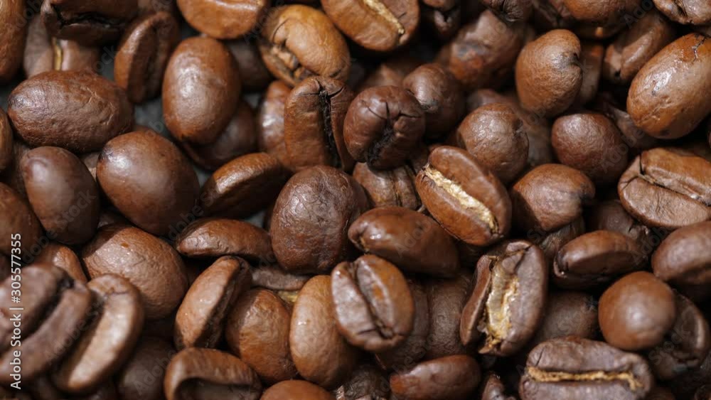 Coffee beans rotate on the pan Coffee beans rotate on the pan