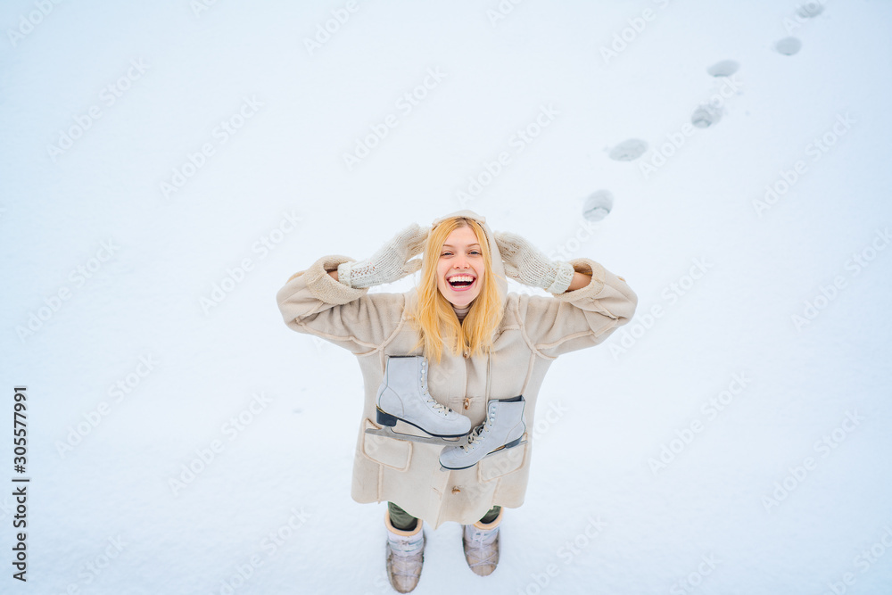 Enjoying nature wintertime. Winter landscape background. Funny young woman in the winter time. Love winter. Beautiful woman walking in winter park and feeling wonderful. Enjoying nature wintertime. Winter landscape background. Funny young woman in the winter time. Love winter. Beautiful woman walking in winter park and feeling wonderful.