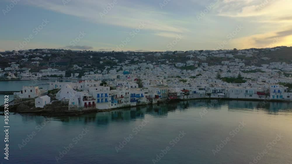 Aerial drone panoramic video of picturesque old port in main village of Mykonos island at sunset with beautiful colours at sunrise, Cyclades, Greece
