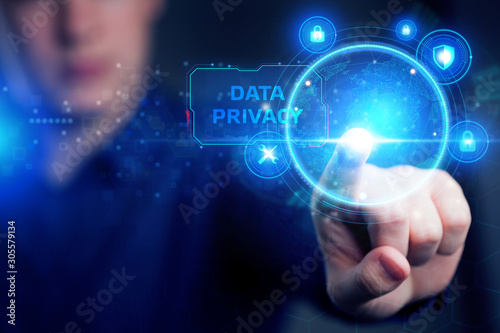 Cyber security data protection business technology privacy concept. Young businessman working in the office, select the icon security on the virtual display. Data privacy