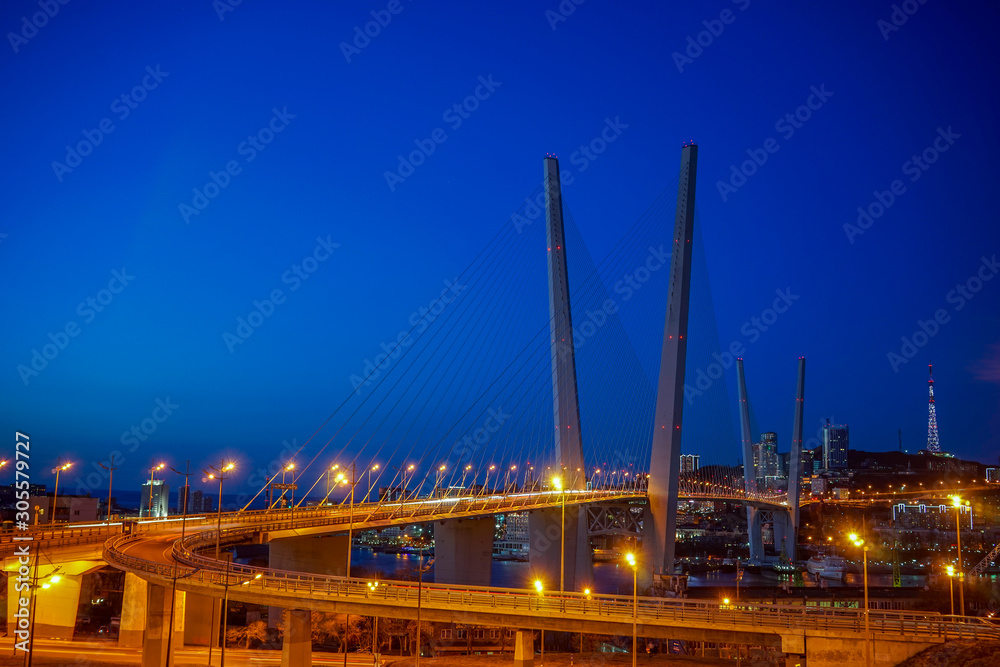 Golden bridge against the blue evening sky. Golden bridge against the blue evening sky.