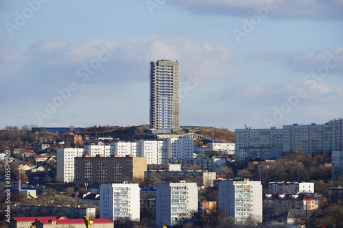 Cityscape on the background of mountains and sky. Vladivostok, Russia