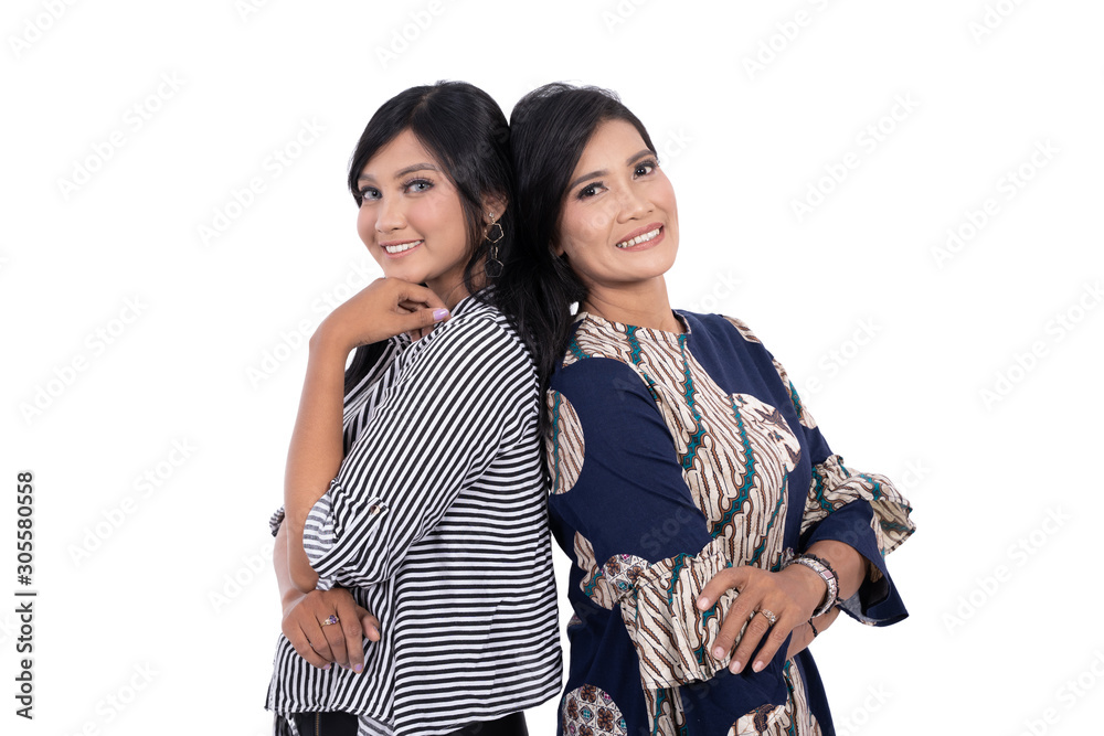 Asian young woman and her mothers smile looking the camera and lean on each other with white background