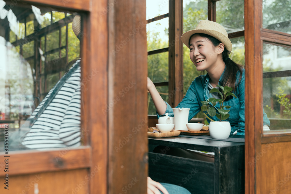 Interior traditional japanese style design decoration in old wooden house. two asian chinese girl tourists travel in japan kyoto in spring. view through wood window and doors ladies laughing gossip Interior traditional japanese style design decoration in old wooden house. two asian chinese girl tourists travel in japan kyoto in spring. view through wood window and doors ladies laughing gossip