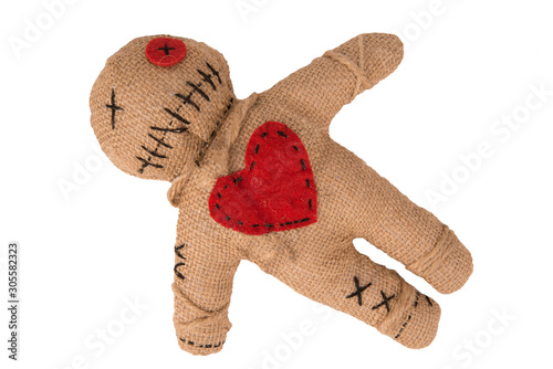 Voodoo doll with in burlap fabric, isolated on white background. Directly above. Cut out.