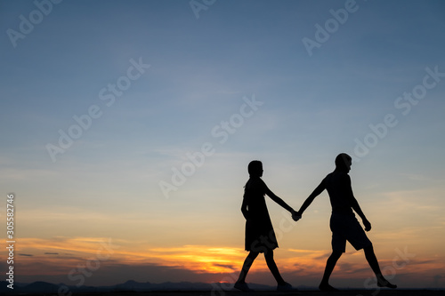 Couple in love silhouette during sunset,Harmony in relationship concept,romantic.