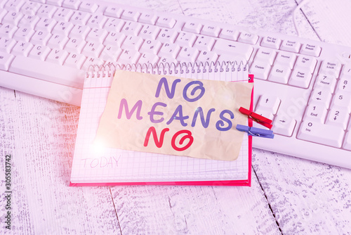 Conceptual hand writing showing No Means No. Concept meaning Stop abuse gender violence Negative response Sexual harassment notebook reminder clothespin with pinned sheet light wooden photo