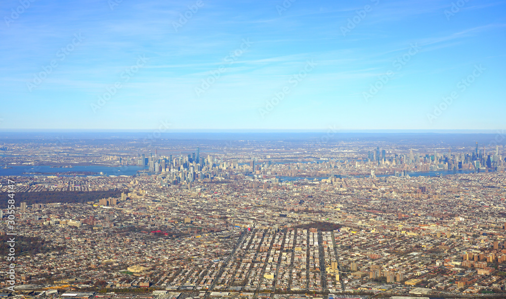 Aerial view of the New York City area with Queens, Brooklyn and Manhattan seen from an airplane window