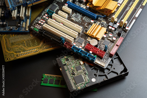 group of old and used computer component part on dark background.  recycle and electronic waste concept.