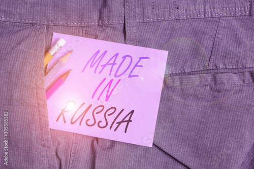 Writing note showing Made In Russia. Business concept for A product or something that is analysisufactured in Russia Writing equipment and purple note paper inside pocket of trousers