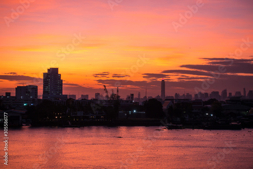 Aerial view of Bangkok Skyline along Chaophraya River sunset twilight