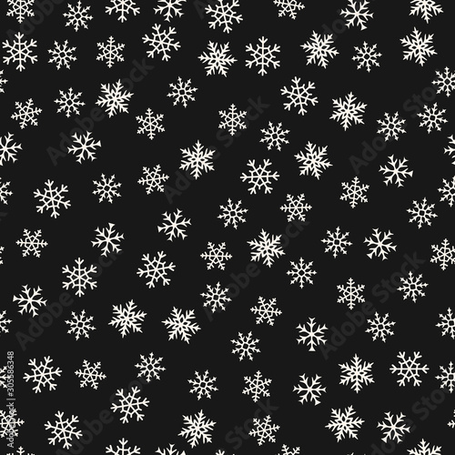 Vector snowflakes pattern. Winter Christmas decorative seamless background with small scattered snow flakes. Abstract black and white texture. Simple minimal monochrome ornament. Dark repeat design
