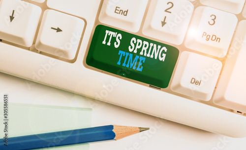 Text sign showing It S Spring Time. Business photo showcasing Season After Winter Bloosoming of Flowers Transformation White pc keyboard with empty note paper above white background key copy space photo