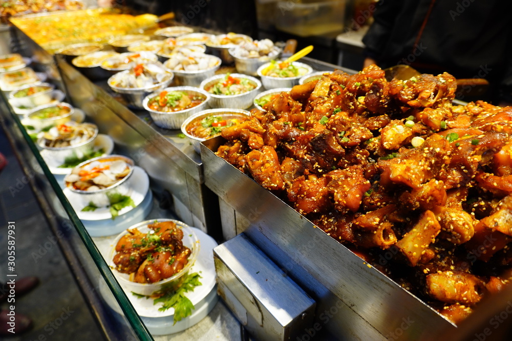 Sichuan style snack like mala pork knuckles, chili oil steam seafood at Jinli ancient street.