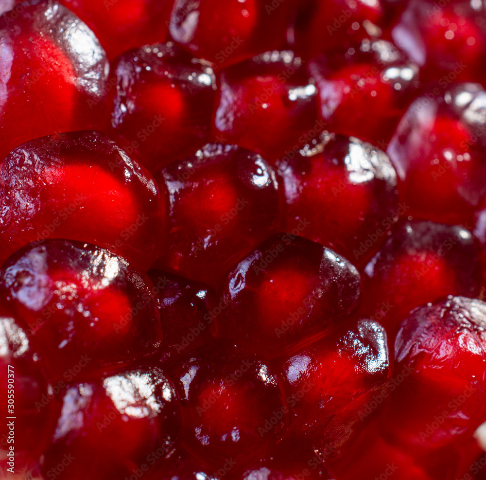 ripe pomegranate rustic style on black isolated background still life