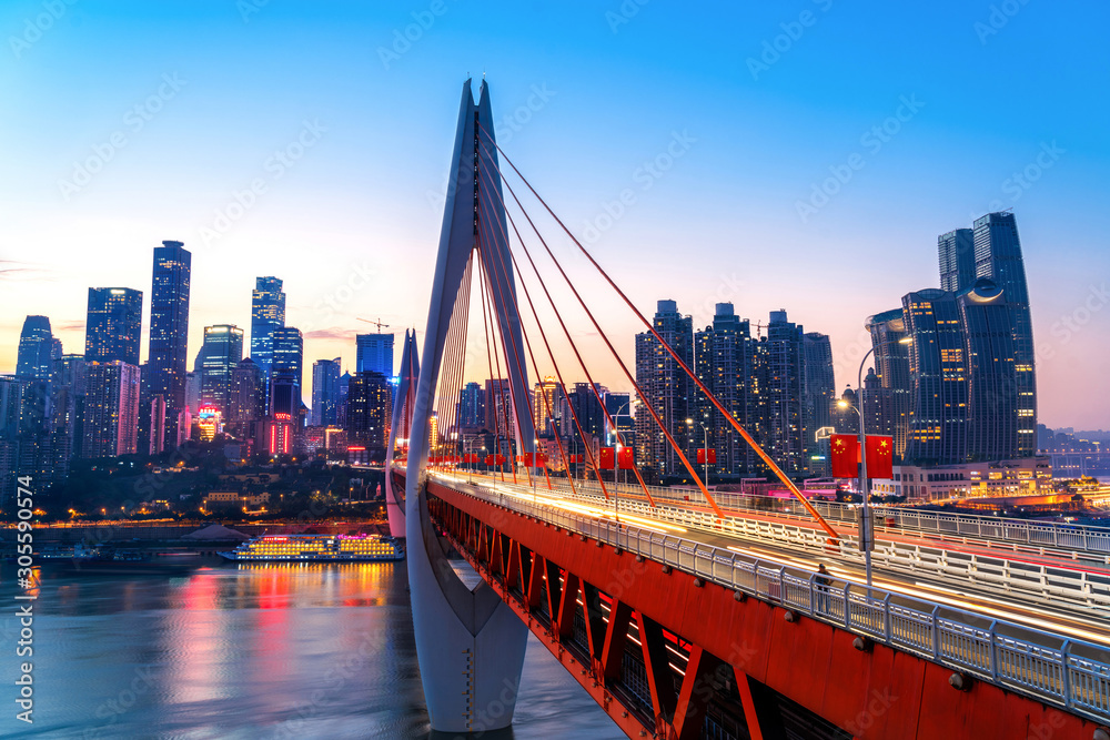 Obraz premium cityscape and skyline of downtown near water of chongqing at night