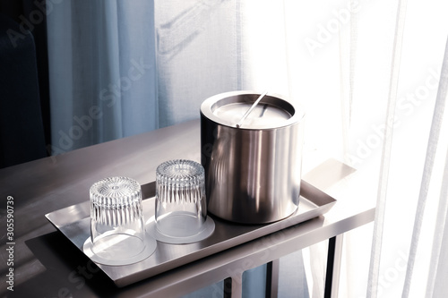 Stainless steel ice bucket.
